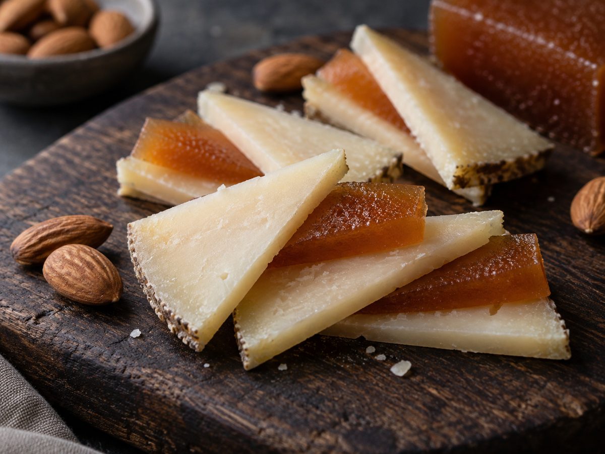 Slices of quince paste layered with sheep's milk cheese and almonds